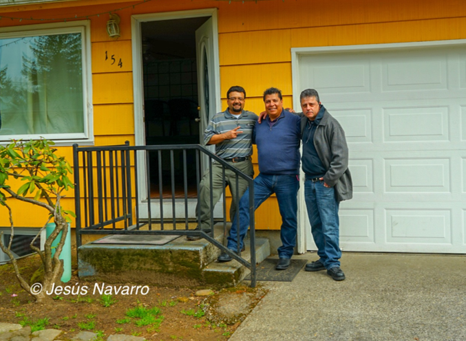 Three men standing in front of LHBR house